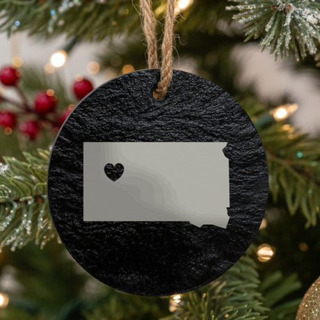 South Dakota round slate Christmas ornament engraved with the state shape and a heart