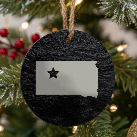 South Dakota round slate Christmas ornament engraved with the state shape and a star