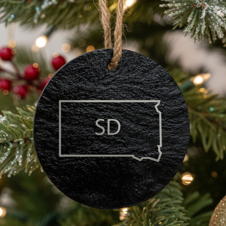 South Dakota round slate Christmas ornament engraved with the state outline and SD initials