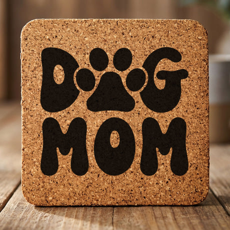 Square cork coaster laser engraved with a retro bubble letter Dog Mom design with a paw print