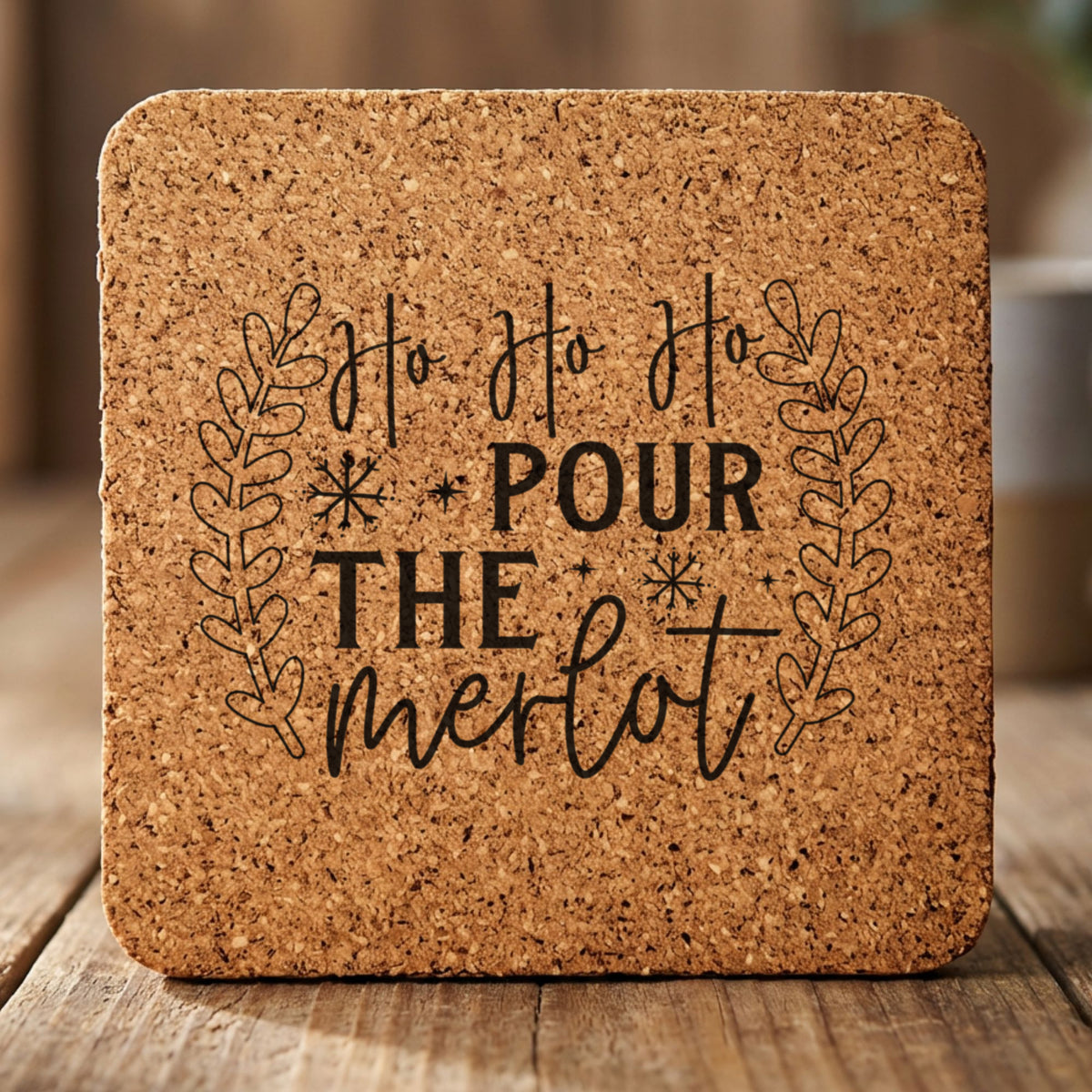 Square cork coaster laser engraved with "Ho Ho Ho Pour the Merlot"