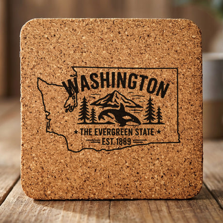 Washington square cork coaster engraved with the state outline, an orca, Mount Rainier and evergreens, "The Evergreen State"