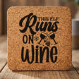 Square cork coaster laser engraved with "This Elf Runs on Wine"