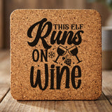 Square cork coaster laser engraved with "This Elf Runs on Wine"