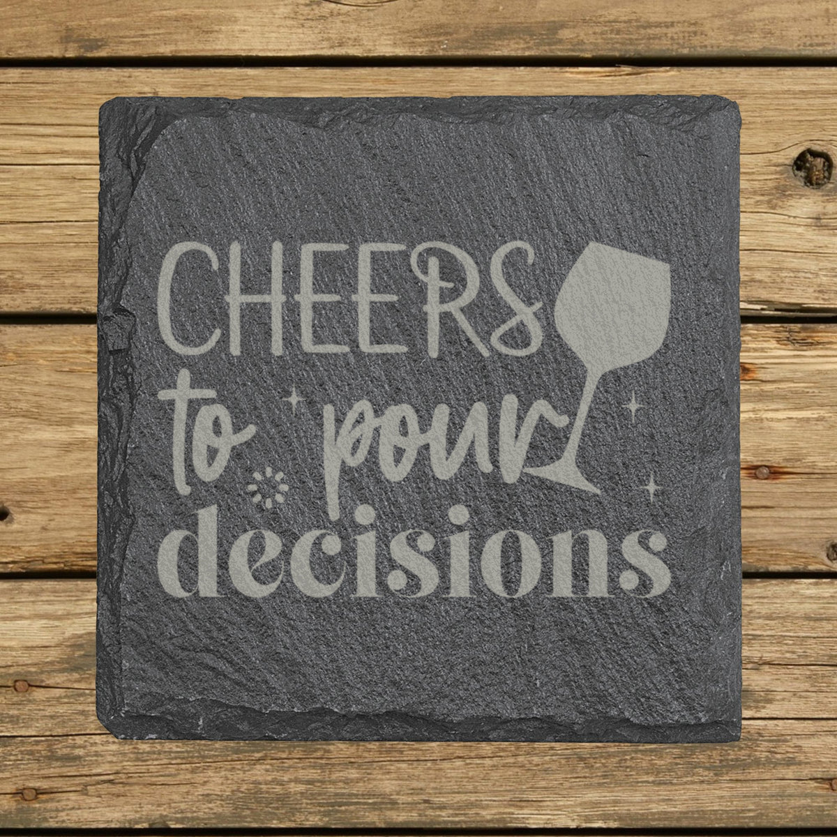 Square slate coaster laser engraved with "Cheers to Pour Decisions"