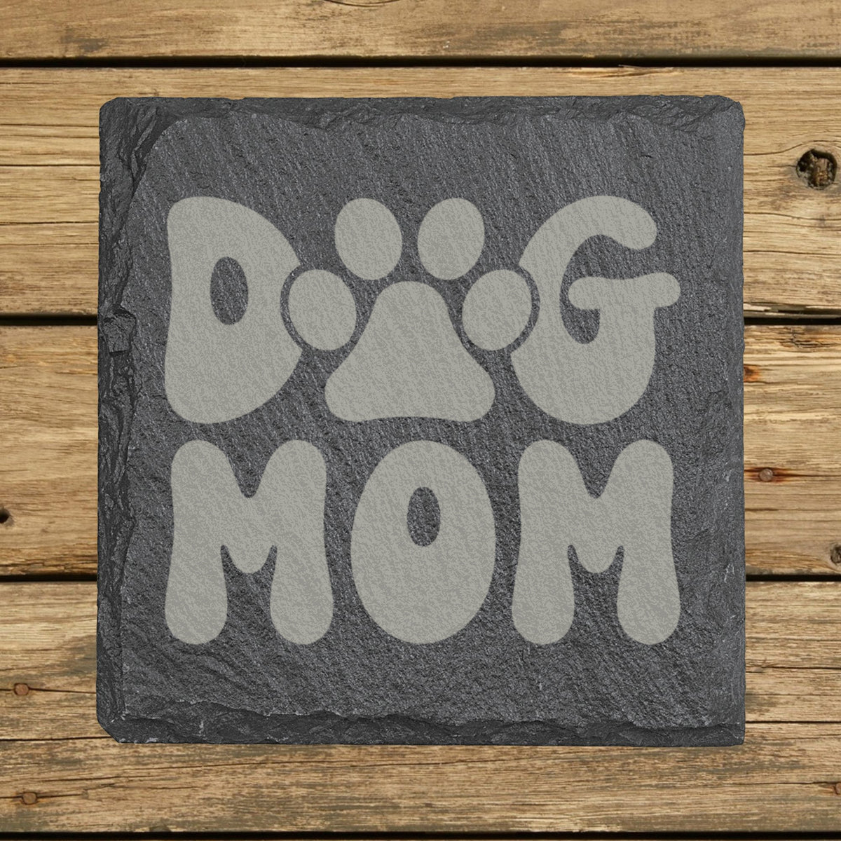 Square slate coaster laser engraved with a retro bubble letter Dog Mom design with a paw print