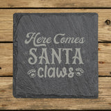 Square slate coaster laser engraved with "Here Comes Santa Claws"