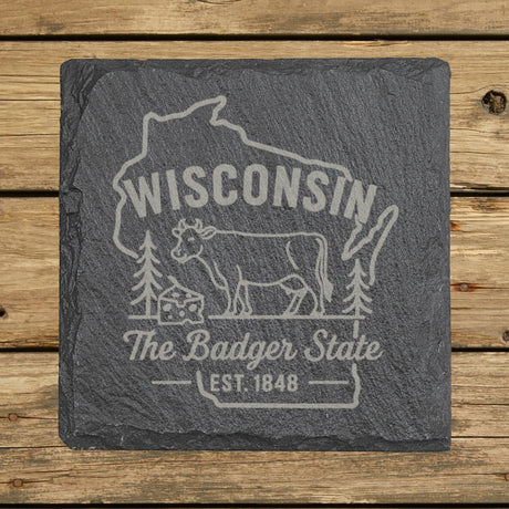 Wisconsin square slate coaster engraved with the state outline, a dairy cow and a wedge of cheese, "The Badger State"