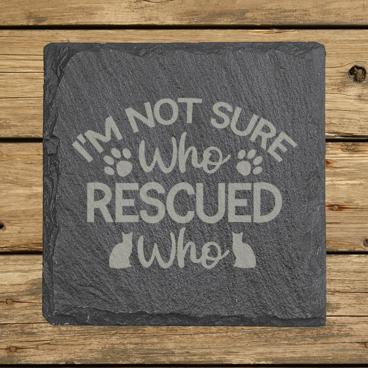 Square slate coaster laser engraved with "I'm Not Sure Who Rescued Who"