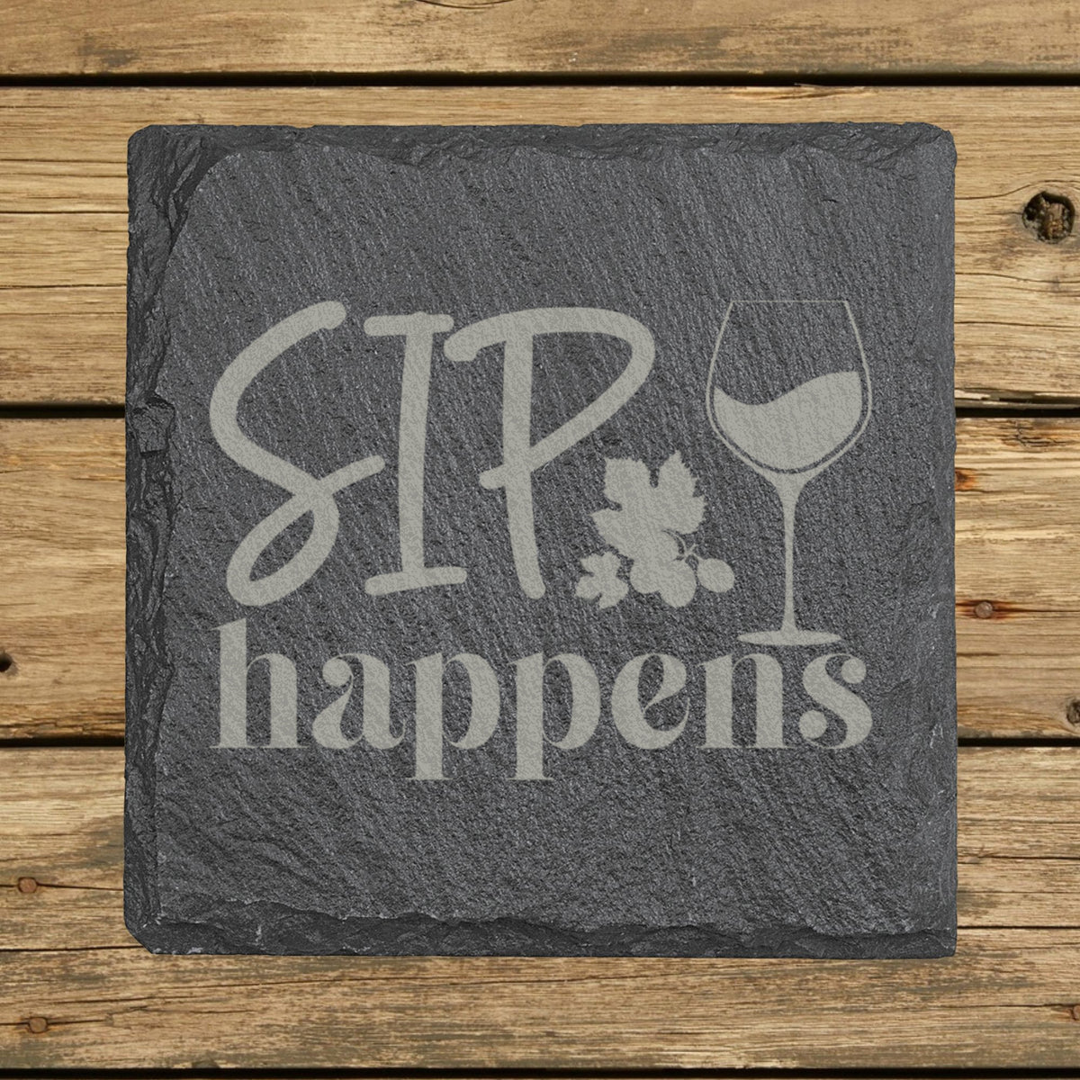 Square slate coaster laser engraved with "Sip Happens"