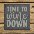 Square slate coaster laser engraved with "Time to Wine Down", classic design