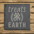 Square slate coaster laser engraved with "Treats on Earth"