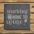 Square slate coaster laser engraved with "Working Nine to Wine"