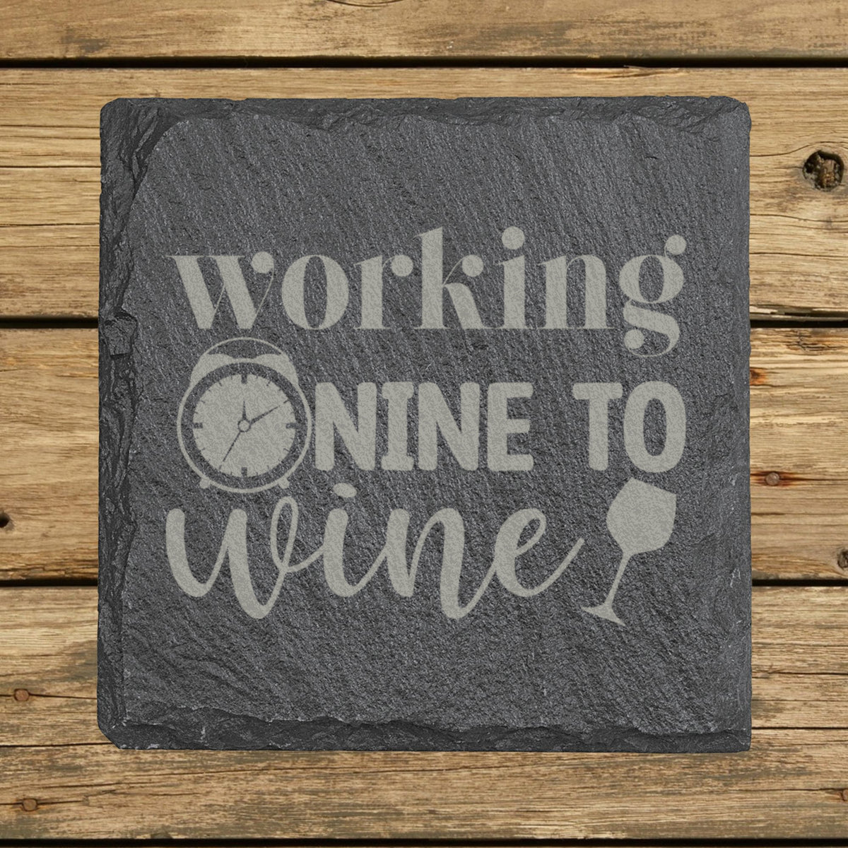 Square slate coaster laser engraved with "Working Nine to Wine"