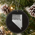 Black leatherette round Christmas ornament laser engraved with the Nevada Floral Damask design, hanging on a tree