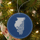 Blue leatherette round Christmas ornament laser engraved with the Illinois Floral Damask design, hanging on a tree