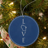 Blue leatherette round Christmas ornament laser engraved with the Wisconsin LOVE Stacked design, hanging on a tree