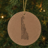 Brown leatherette round Christmas ornament laser engraved with the Delaware Word Cloud design, hanging on a tree