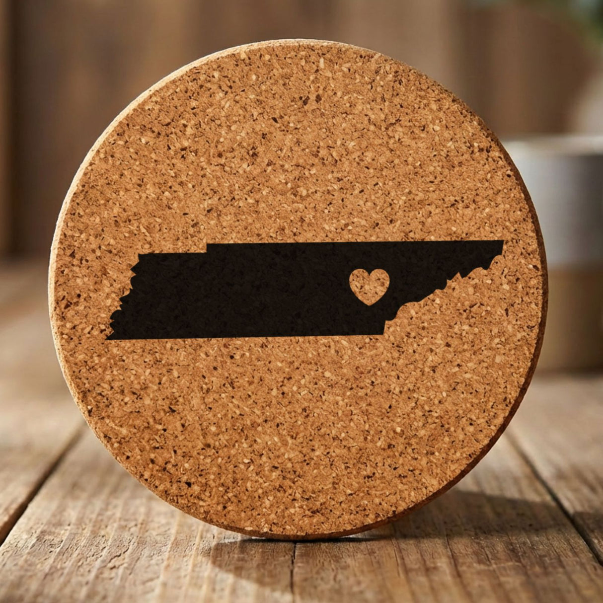 Tennessee round cork coaster engraved with the state shape and a heart