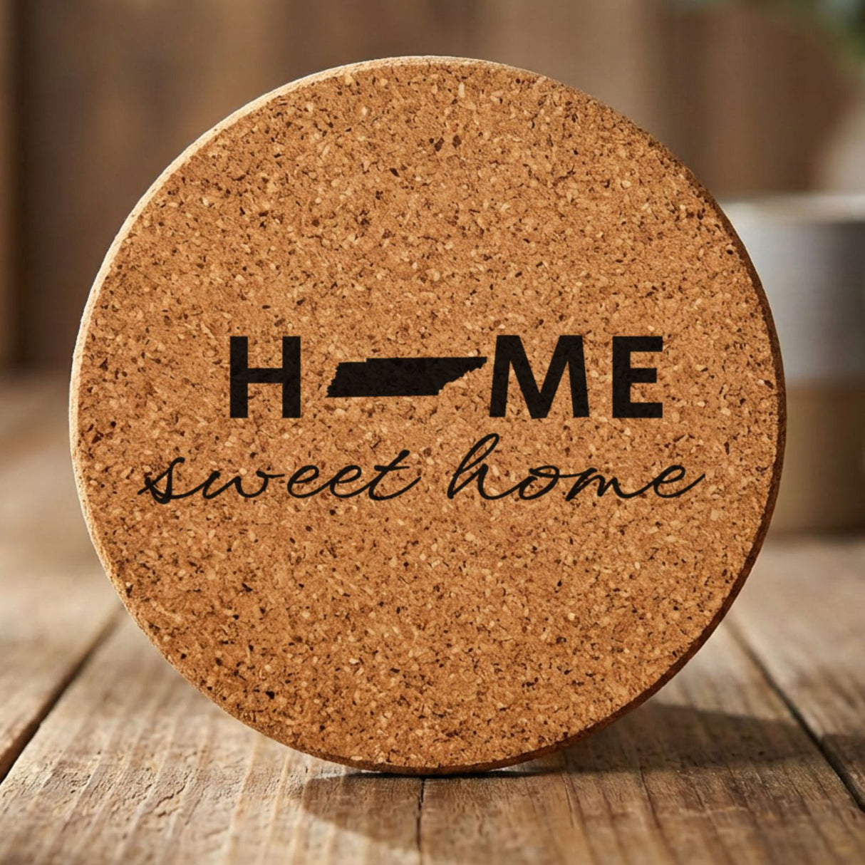 Tennessee round cork coaster engraved with HOME sweet home using the state shape as the letter O