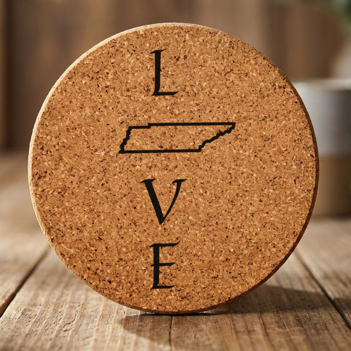 Tennessee round cork coaster engraved with LOVE stacked vertically using the state as the letter O