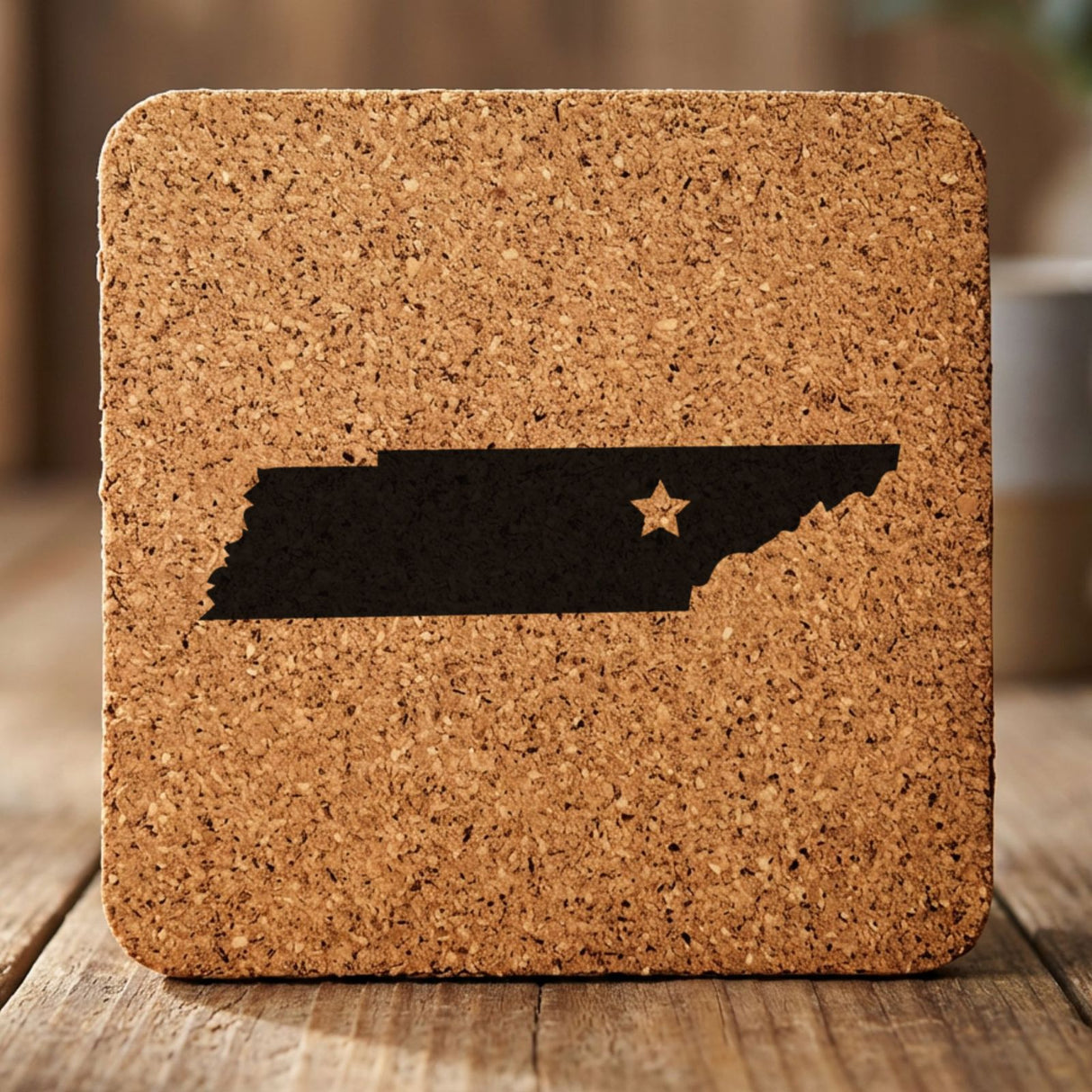 Tennessee square cork coaster engraved with the state shape and a star