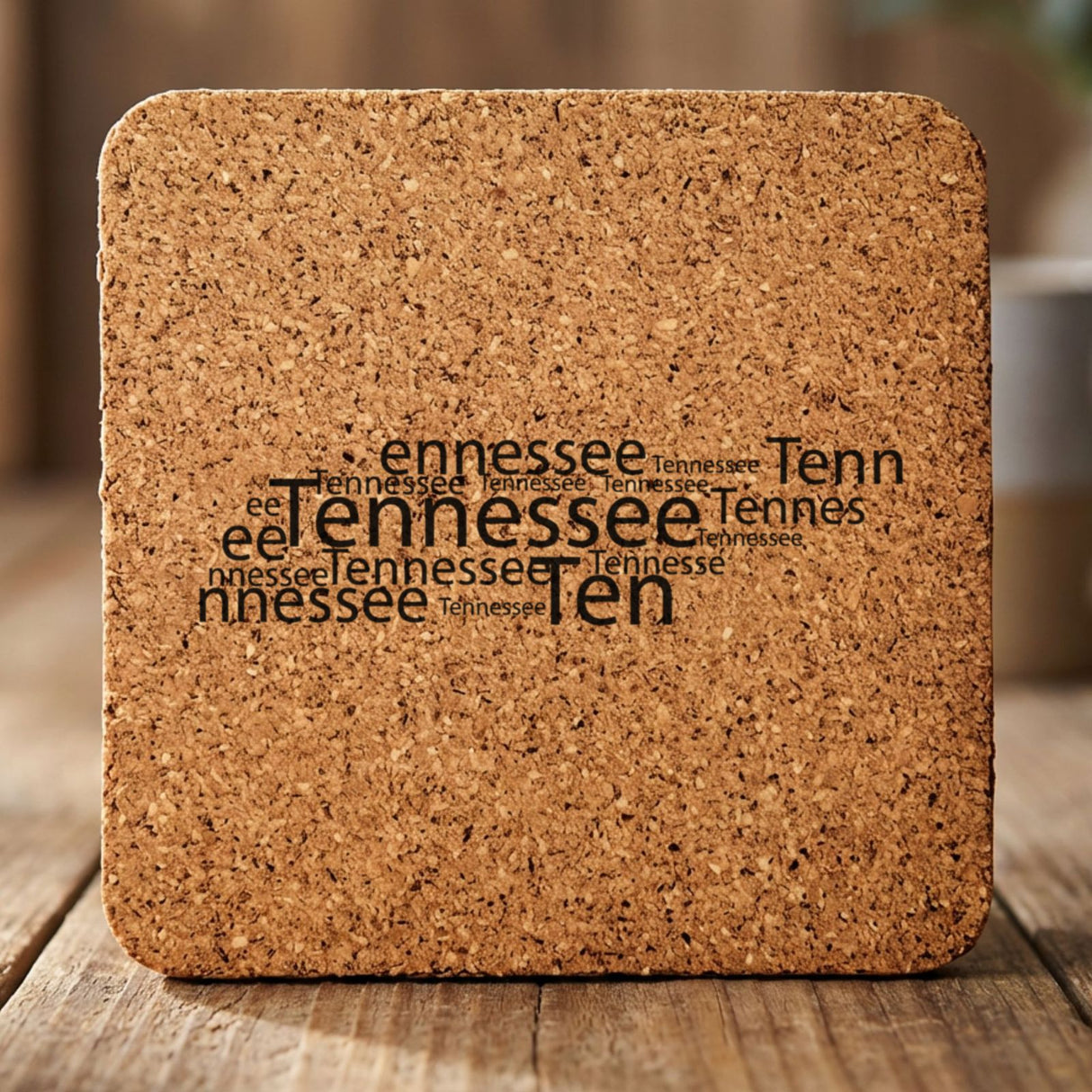 Tennessee square cork coaster engraved with a word cloud of repeating Tennessee text