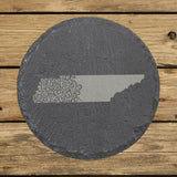 Tennessee round slate coaster engraved with the state shape in ornate floral scrollwork