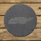 Tennessee round slate coaster engraved with a word cloud of repeating Tennessee text