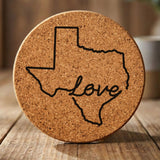 Texas round cork coaster engraved with a hand-drawn state outline and love in cursive