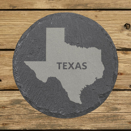 Texas round slate coaster engraved with the state shape and TEXAS in bold lettering