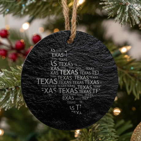 Texas round slate Christmas ornament engraved with a word cloud of repeating Texas text