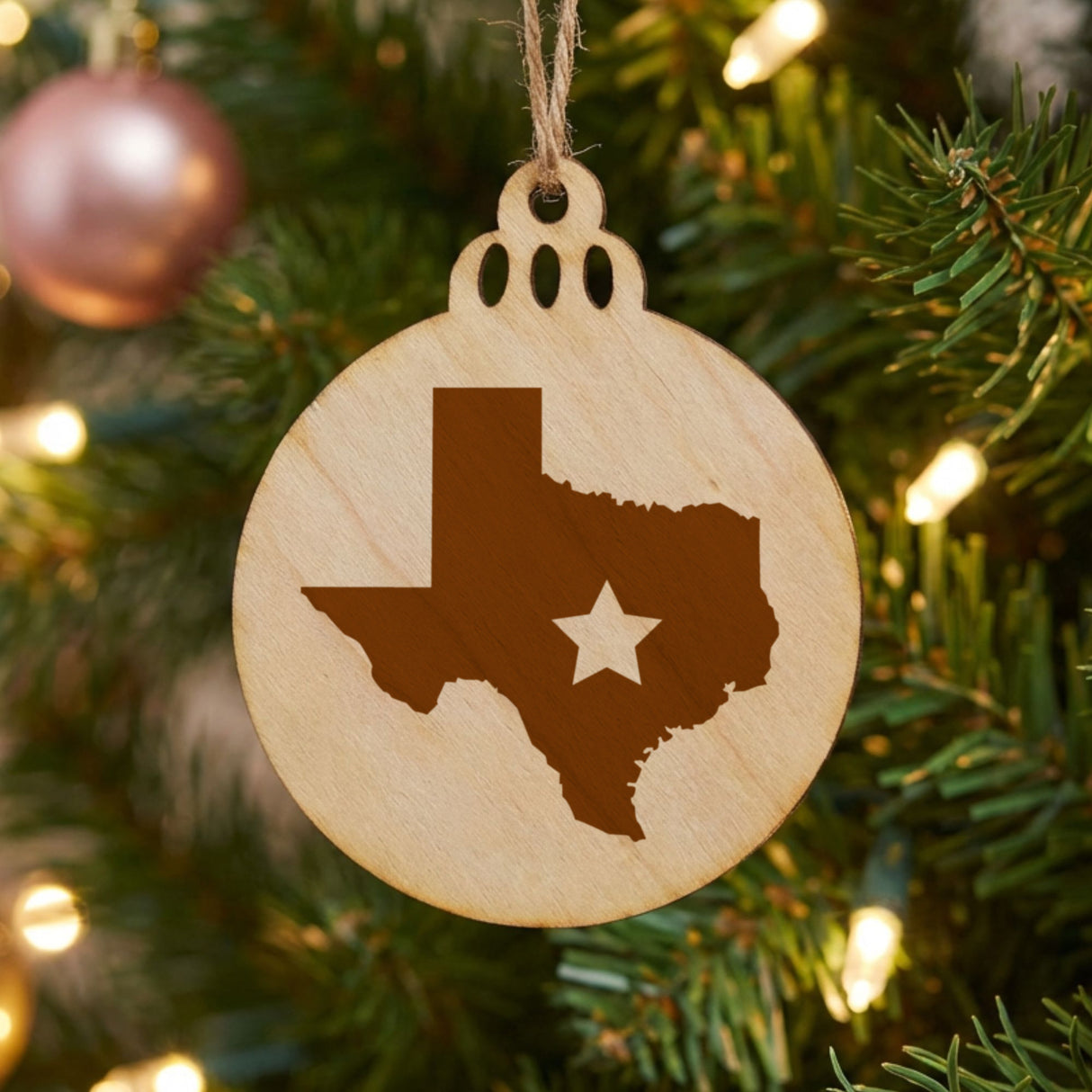 Texas round wood Christmas ornament engraved with the state shape and a star