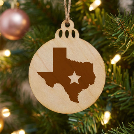 Texas round wood Christmas ornament engraved with the state shape and a star
