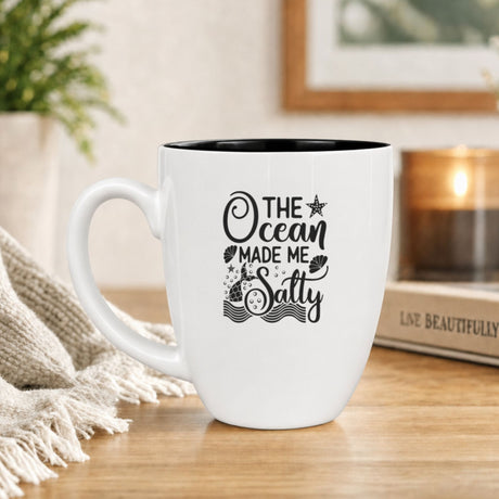 White 16 oz ceramic coffee mug with "The Ocean Made Me Salty"