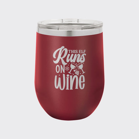 Maroon 12 oz stemless wine tumbler laser engraved with "This Elf Runs on Wine"