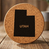 Utah round cork coaster engraved with the state shape and UTAH in bold lettering