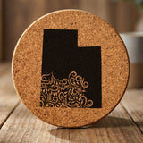 Utah round cork coaster engraved with the state shape in ornate floral scrollwork
