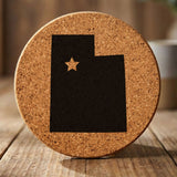 Utah round cork coaster engraved with the state shape and a star