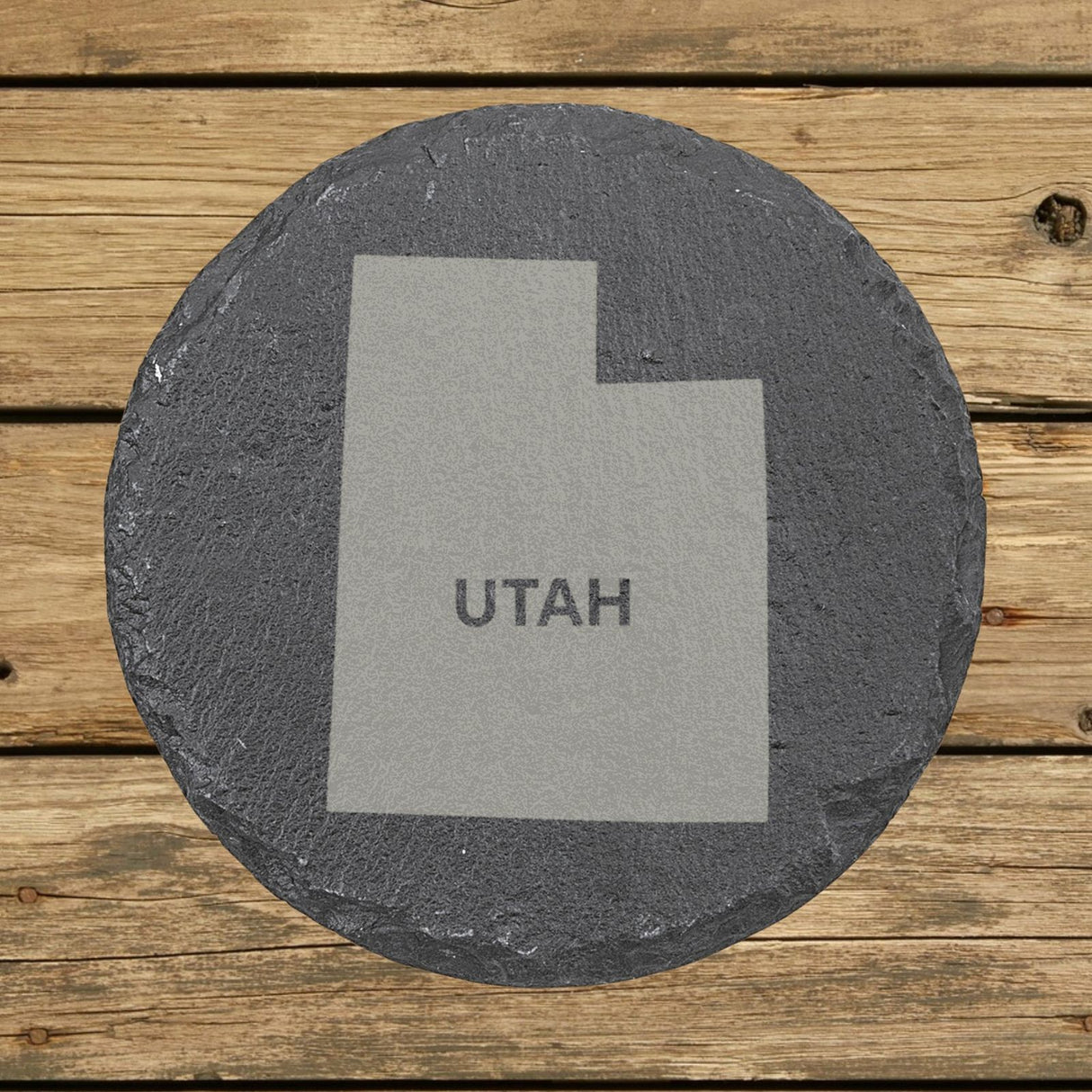 Utah round slate coaster engraved with the state shape and UTAH in bold lettering