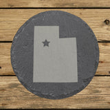 Utah round slate coaster engraved with the state shape and a star