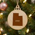 Utah round wood Christmas ornament engraved with the state shape and UTAH in bold lettering