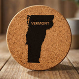 Vermont round cork coaster engraved with the state shape and VERMONT in bold lettering