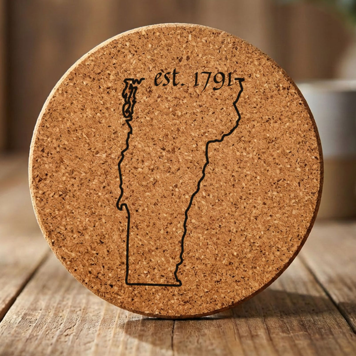 Vermont round cork coaster engraved with the state outline and est. 1791