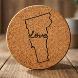 Vermont round cork coaster engraved with a hand-drawn state outline and love in cursive