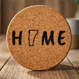 Vermont round cork coaster engraved with HOME using the state outline as the letter O