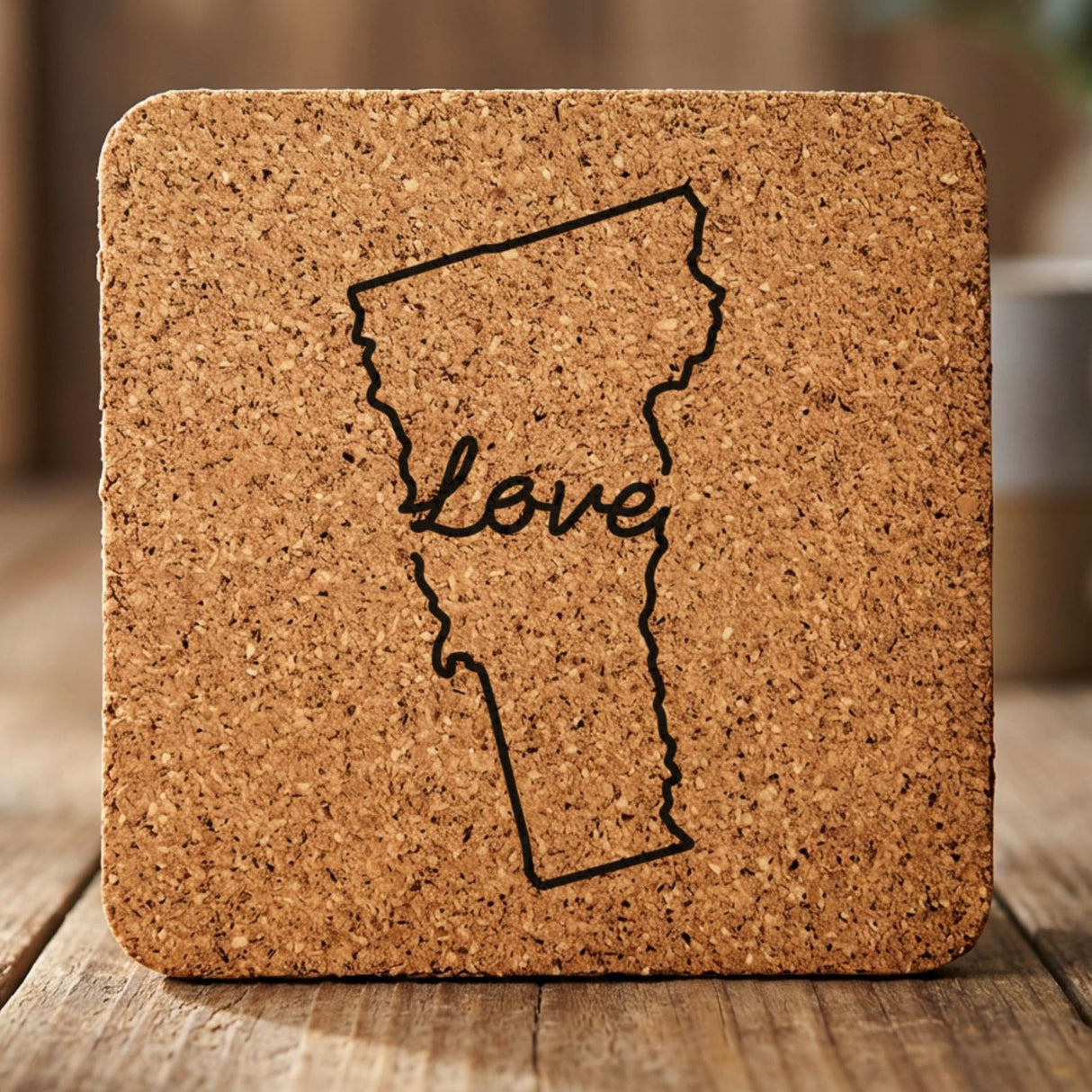 Vermont square cork coaster engraved with a hand-drawn state outline and love in cursive