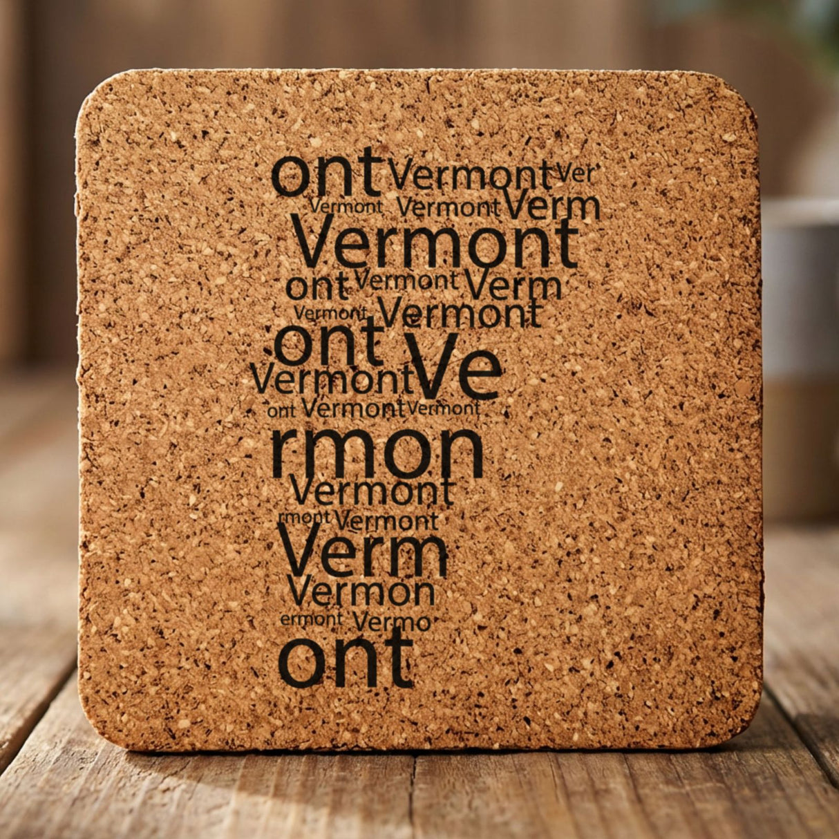 Vermont square cork coaster engraved with a word cloud of repeating Vermont text