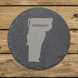 Vermont round slate coaster engraved with the state shape and VERMONT in bold lettering