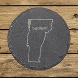 Vermont round slate coaster engraved with the state outline and VERMONT in hand-drawn brush lettering